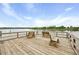 Wooden dock overlooking the water with built-in benches for relaxing and enjoying the view at 8400 Camp Gregg Ln, North Charleston, SC 29418