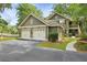 Charming home with a two-car garage and lush landscaping, offering curb appeal and convenience at 8400 Camp Gregg Ln, North Charleston, SC 29418
