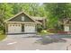 Charming home with a two-car garage and lush landscaping, offering curb appeal and convenience at 8400 Camp Gregg Ln, North Charleston, SC 29418