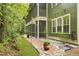 Beautiful landscaped yard with walkway to screened porch at 8400 Camp Gregg Ln, North Charleston, SC 29418