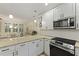 Bright kitchen featuring granite countertops, stainless steel appliances, and stylish cabinets at 8400 Camp Gregg Ln, North Charleston, SC 29418