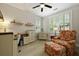 Office with wood floors, large windows with shutters, desk and seating area at 8400 Camp Gregg Ln, North Charleston, SC 29418