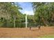 Scenic pond featuring a bench overlooking a fountain and surrounded by lush greenery, perfect for relaxation and contemplation at 8400 Camp Gregg Ln, North Charleston, SC 29418