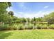 Picturesque pond with a fountain, surrounded by lush trees and greenery, creating a tranquil and inviting natural setting at 8400 Camp Gregg Ln, North Charleston, SC 29418