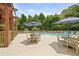 Resort-style pool area with ample seating, umbrellas, and a relaxing atmosphere for residents and guests at 8400 Camp Gregg Ln, North Charleston, SC 29418