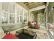 Covered porch with outdoor furniture and decor at 8400 Camp Gregg Ln, North Charleston, SC 29418