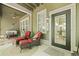 Covered porch with seating area, ceiling fan, outdoor rug and view of yard at 8400 Camp Gregg Ln, North Charleston, SC 29418