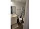 Well-lit bathroom with a vanity, toilet, and shower at 9430 Sweep Dr, Summerville, SC 29485