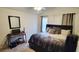 Comfortable bedroom with a bed, desk, and window at 9430 Sweep Dr, Summerville, SC 29485