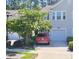 Two-story home with a well-maintained lawn and a driveway with a parked car at 9430 Sweep Dr, Summerville, SC 29485