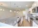 Open kitchen with stainless steel appliances, granite countertops, and a large island at 9430 Sweep Dr, Summerville, SC 29485