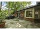 Concrete back patio with a grill, seating, and view of lush greenery at 96 King Charles Cir, Summerville, SC 29485