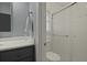 Well-lit bathroom features a glass shower door, light gray walls, and a stylish vanity at 96 King Charles Cir, Summerville, SC 29485