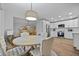 Open concept dining area features decoratively placed furniture and lots of natural light at 96 King Charles Cir, Summerville, SC 29485