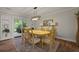 Charming dining room with wood floors, modern lighting, and access to outdoor patio at 96 King Charles Cir, Summerville, SC 29485