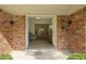 Inviting entryway with brick walls and stone floors leading to a bright, open interior at 96 King Charles Cir, Summerville, SC 29485