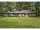 Charming brick home with well-manicured lawn and mature trees offering classic curb appeal at 96 King Charles Cir, Summerville, SC 29485