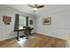 Cozy home office featuring hardwood floors, gray walls, and a ceiling fan at 96 King Charles Cir, Summerville, SC 29485