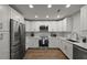 Modern kitchen with white cabinets, stainless steel appliances, and marble backsplash at 96 King Charles Cir, Summerville, SC 29485
