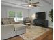 Spacious living room features a comfortable sofa, large window, and ceiling fan at 96 King Charles Cir, Summerville, SC 29485