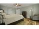 Well-lit bedroom featuring a ceiling fan, side-chair, large windows, and ample natural light at 96 King Charles Cir, Summerville, SC 29485