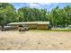 A community pool with changing rooms and ample parking for residents, set amidst lush greenery and mature trees at 96 King Charles Cir, Summerville, SC 29485