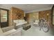 Inviting sunroom with brick walls, comfortable seating, and view of the backyard at 96 King Charles Cir, Summerville, SC 29485