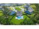 Aerial view of a home with a pool, a manicured lawn and fence in a beautiful neighborhood at 106 Claremont Ct, Summerville, SC 29486