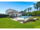 Beautiful backyard featuring a large pool with an attached hot tub, a hammock, and a patio at 106 Claremont Ct, Summerville, SC 29486