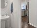 Powder room with pedestal sink and view into the kitchen with stainless fridge at 106 Claremont Ct, Summerville, SC 29486
