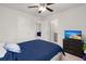 Bright bedroom features a ceiling fan, a tv, and access to the bathroom at 106 Claremont Ct, Summerville, SC 29486