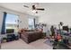 Bedroom featuring dual windows, ceiling fan, bed, desk and lots of decorations at 106 Claremont Ct, Summerville, SC 29486