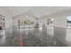 Spacious clubhouse interior with sleek concrete floors, vaulted ceilings, and access to community amenities at 106 Claremont Ct, Summerville, SC 29486