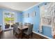 Bright dining room with seating for six, modern decor and access to the outdoor patio and pool at 106 Claremont Ct, Summerville, SC 29486