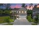 Charming two-story brick home with well-maintained landscaping, two-car garage, and a beautiful twilight sky at 106 Claremont Ct, Summerville, SC 29486