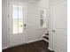 Bright and airy foyer featuring a decorative glass front door, tile flooring, and stairs leading to the upper level at 106 Claremont Ct, Summerville, SC 29486