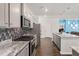 Open kitchen featuring stainless steel appliances, granite countertops, and a mosaic tile backsplash at 106 Claremont Ct, Summerville, SC 29486