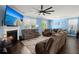 Spacious living room featuring a fireplace, large TV, and comfortable seating at 106 Claremont Ct, Summerville, SC 29486