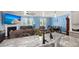 Open floor plan: granite kitchen island, dining area, and living room with fireplace and TV at 106 Claremont Ct, Summerville, SC 29486