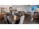 View of open floorplan with a dining room table, kitchen, and living room with fireplace and tv at 106 Claremont Ct, Summerville, SC 29486