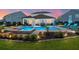 Inviting backyard oasis featuring a sparkling pool, comfortable lounge chairs, and an outdoor seating area at 106 Claremont Ct, Summerville, SC 29486