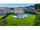 Backyard with a stunning pool, lounge chairs, and a well-manicured lawn, perfect for outdoor relaxation and entertaining at 106 Claremont Ct, Summerville, SC 29486