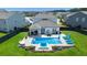 Backyard with a stunning pool, lounge chairs, and a well-manicured lawn, perfect for outdoor relaxation and entertaining at 106 Claremont Ct, Summerville, SC 29486