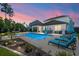 Inviting backyard oasis featuring a sparkling pool, comfortable lounge chairs, and an outdoor seating area at 106 Claremont Ct, Summerville, SC 29486