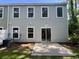 The back of this home features vinyl siding, a concrete patio, and sliding doors to the interior at 109 Rosefield Ct, Summerville, SC 29485