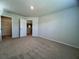 A bright and airy bedroom with neutral carpet, paint and trim, a ceiling light, and multiple doors at 109 Rosefield Ct, Summerville, SC 29485