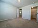 Inviting bedroom with neutral walls and carpet, featuring closet and hall access at 109 Rosefield Ct, Summerville, SC 29485