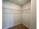 A carpeted walk-in closet with coated wire shelving on three sides for maximum storage at 109 Rosefield Ct, Summerville, SC 29485