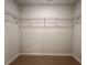 Spacious walk-in closet with wire shelving and neutral carpeting at 109 Rosefield Ct, Summerville, SC 29485