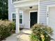 Welcoming entrance features an elegant black door and lovely landscaping at 109 Rosefield Ct, Summerville, SC 29485